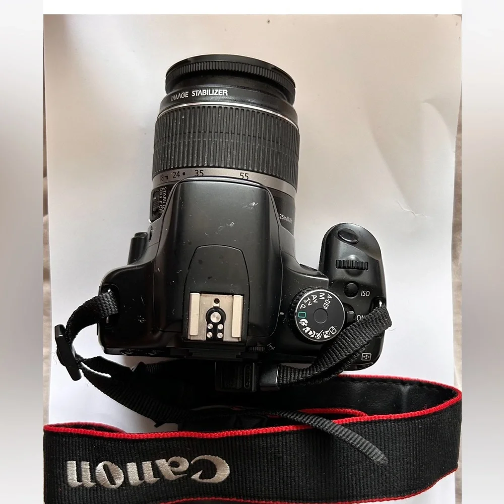 Canon EOS Rebel sxi Camera comes with only as shown in photos